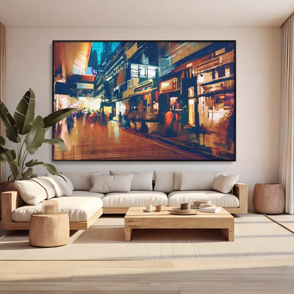 Tablou canvas cu pictura urbana cu strada luminata noaptea, in rama de aluminiu negru, pe perete intr-un living